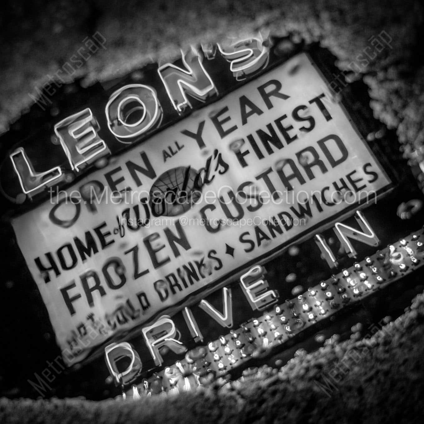 leons frozen custard sign in puddle Black & White Wall Art