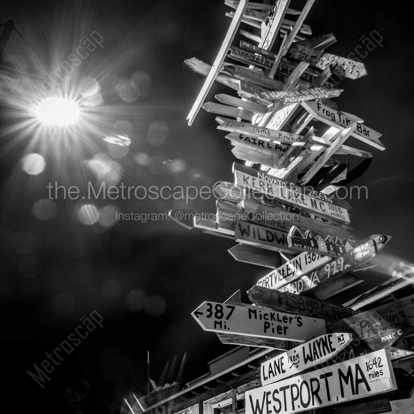 mileage sign post at night Black & White Wall Art