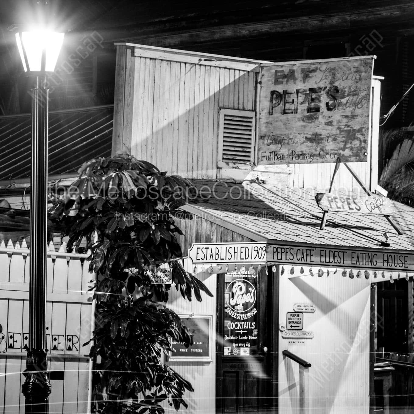 pepes cafe eating house at night Black & White Wall Art